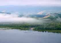  после села в Байкал впадает широкой и сильно разветвленной дельтой река Рель, и берег на протяжении нескольких километров (6-7) заболочен и сильно изрезан протоками...